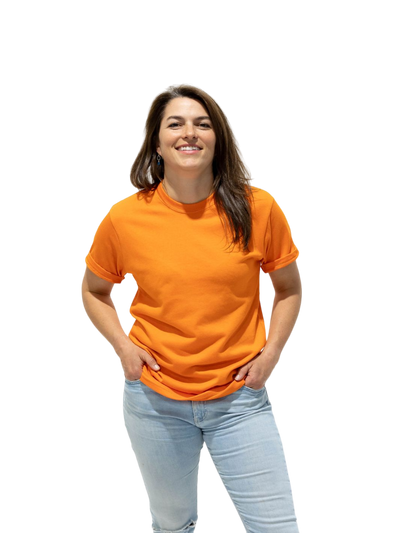 individual sporting a burnt orange Local Laundry Barrier tshirt. Made in Canada and constructed from a premium blend of 50% cotton and 50% polyester.
