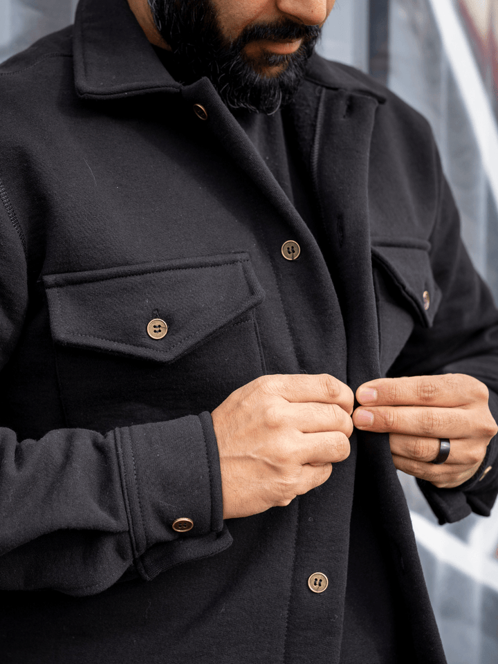 Showcasing the finite details of the Bow River Shacket by Local Laundry, such as the gun metal buttons, and the two chest pockets