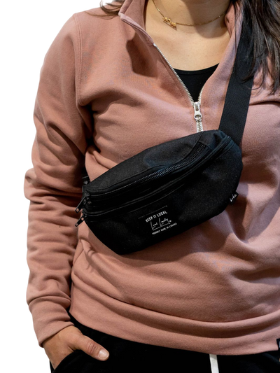 Individual showcasing the Local Laundry Fanny Pack made up of polyester outer shell and a nylon inner pocket. Made in Canmore Alberta, this Fanny Pack is your next essential piece