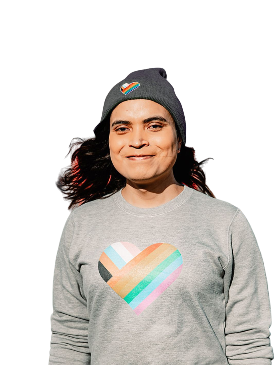 Individual wearing a made in Canada Pride toque, radiating pride with a vibrant rainbow heart on their forehead.