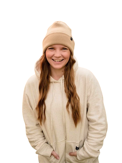 Individual excitingly wearing Local Laundry heavyweight hoodie in cream colour with rainbow speckle. This hoodie is made of 100% ethically sourced cotton and is sustainably made in Canada. 