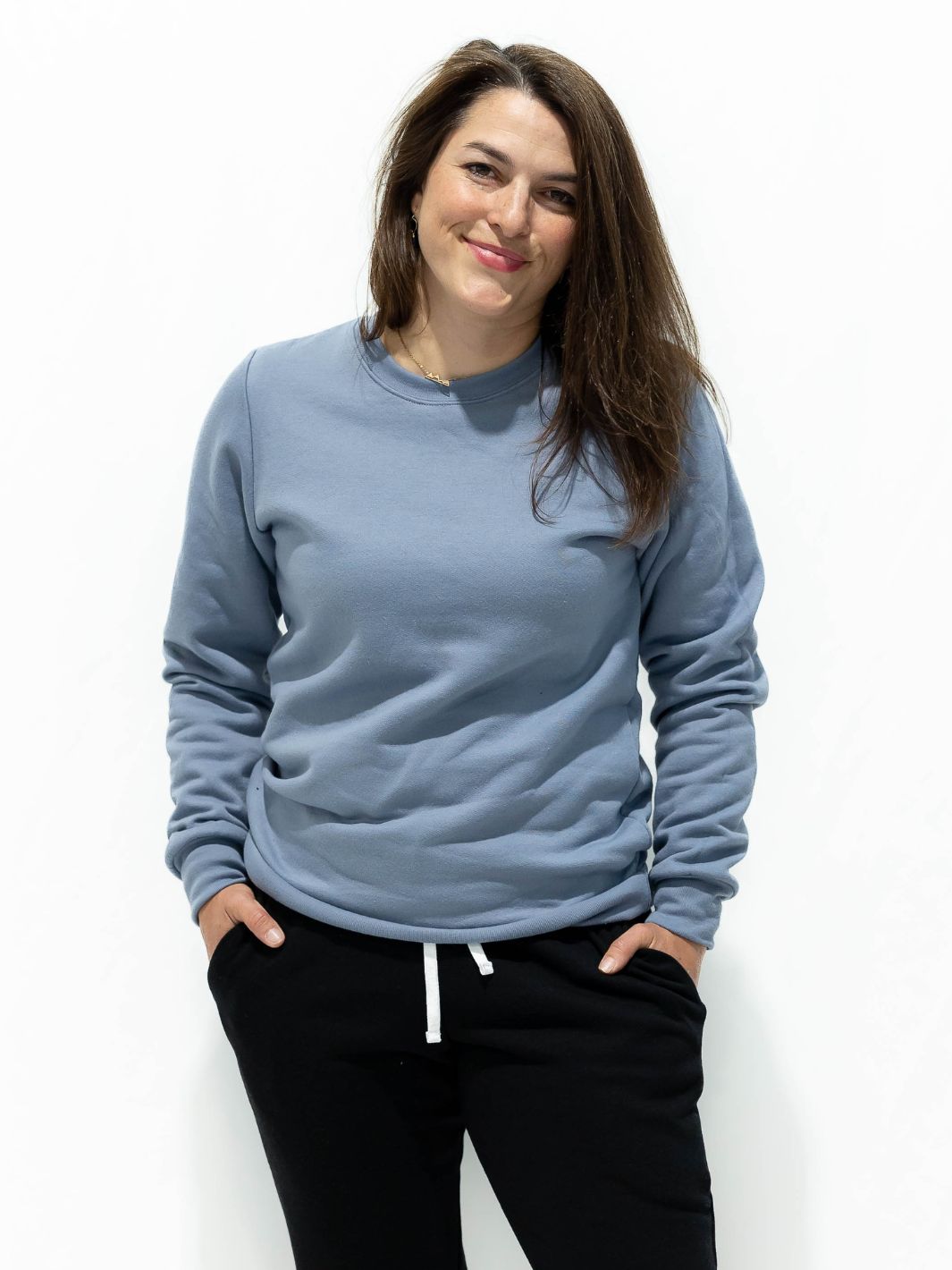 Individual wearing a Local Laundry limited sweater in powder blue. Sustainable fashion - Made in Canada