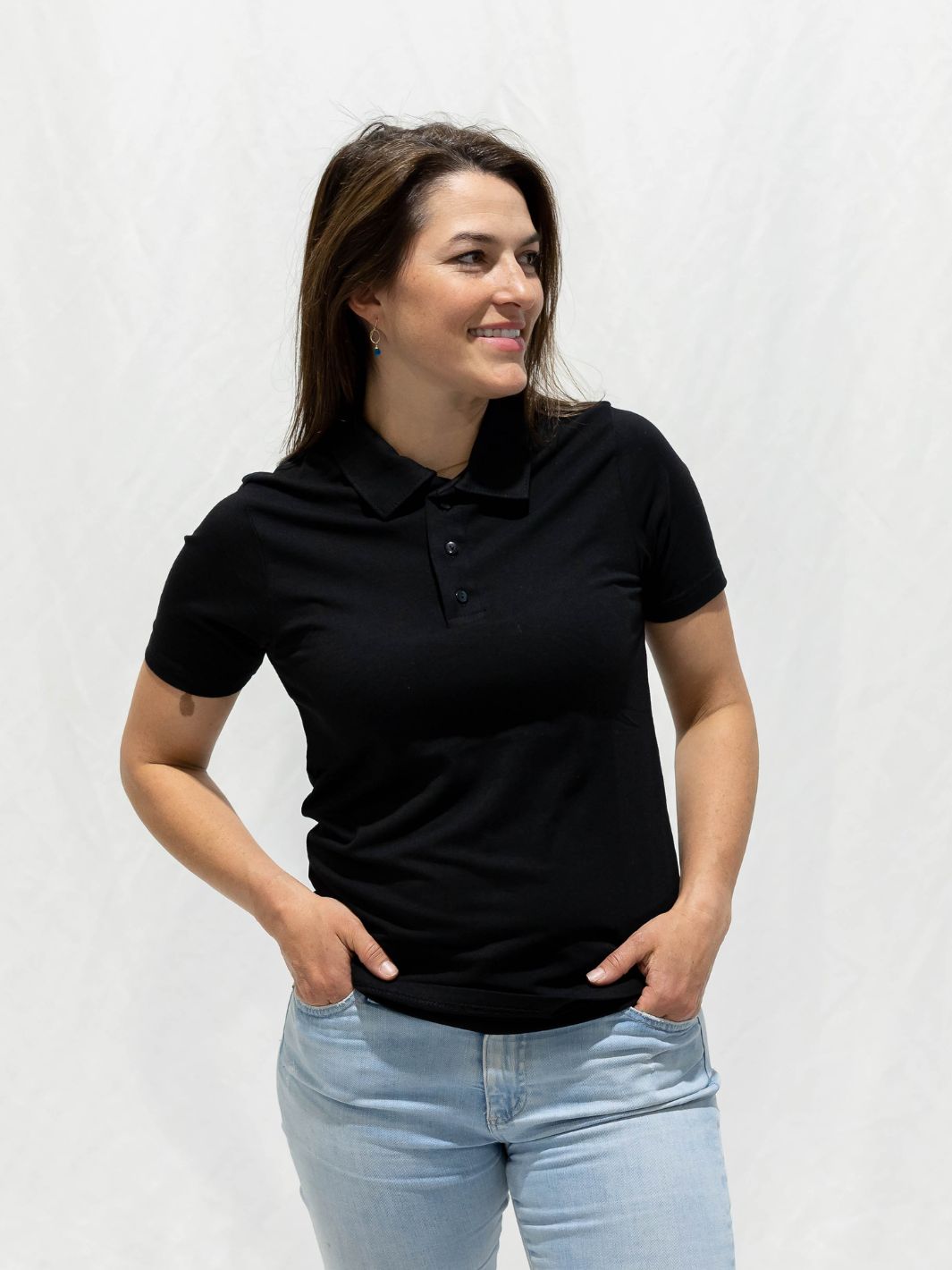 Individual pairing their black Local Laundry Inglewood Polo shirt with a pair of blue jeans. This polo is made in Canada and constructed of bamboo to ensure it's comfortable and cool to wear.