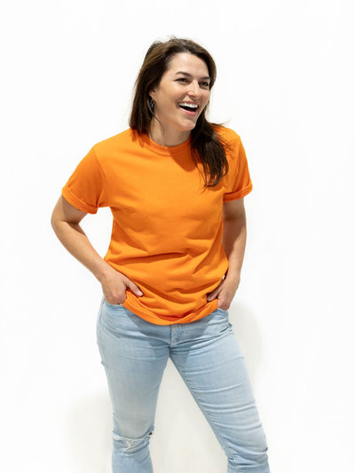 Ecstatic individual hanging out in a orange Local Laundry Barrier shirt. Made in Canada of a 50/50 cotton and polyester blend