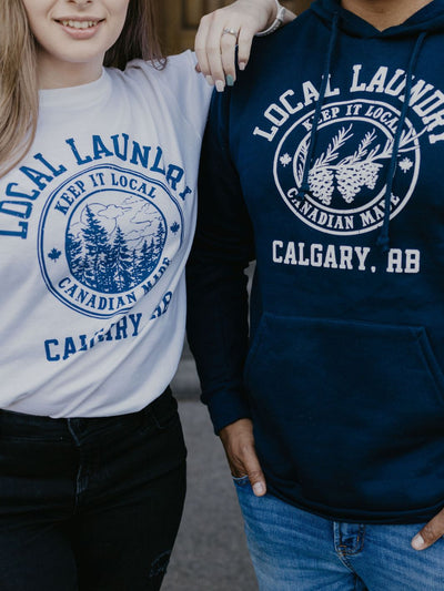 Showcasing the navy blue Varsity hoodie, and white varsity t-shirt