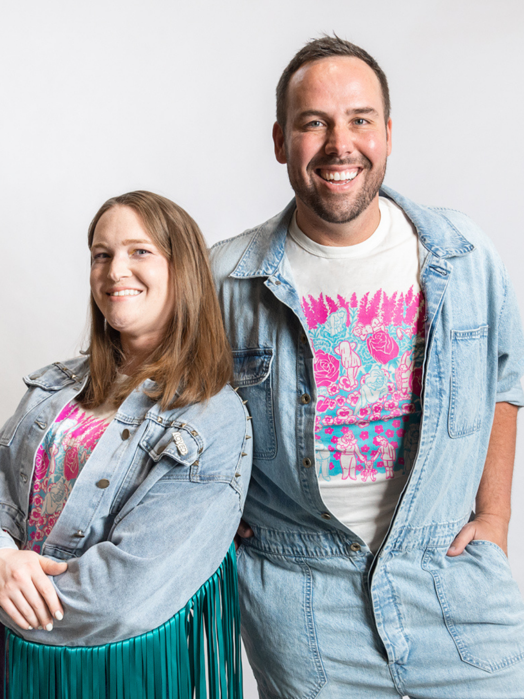 Two individuals wearing a made in Canada shirt that features a design create by a local artist. This shirt represents inclusivity, community, and pride while maintaining the Local Laundry ethos of providing sustainable, ethical, and locally made clothing. 
