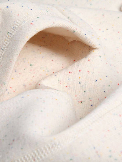 Fine detail of the Local Laundry Heavyweight speckled hoodie's kangaroo pouch, showcasing the finite detail of the multi-color speckle. This hoodie is sustainably made in Canada