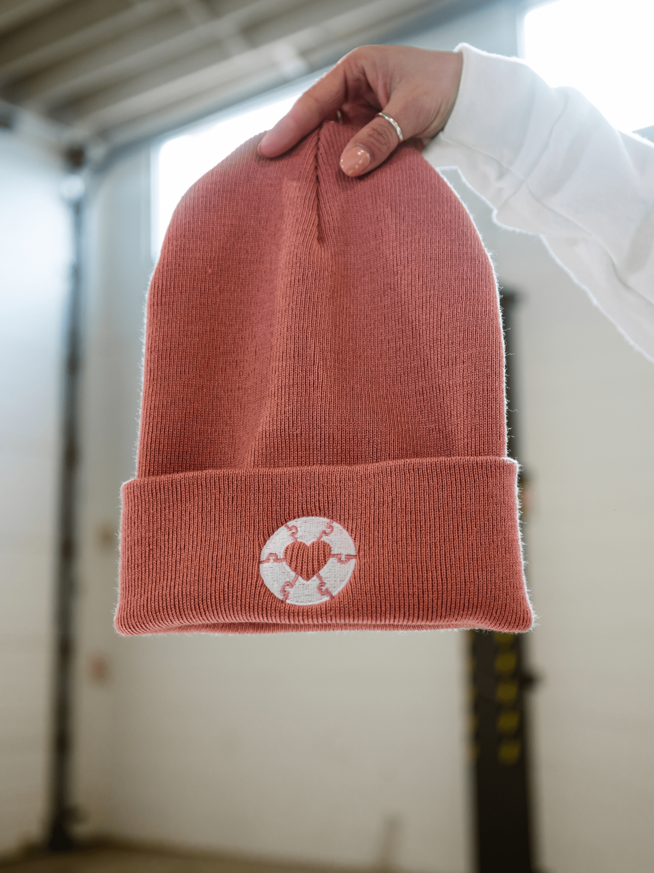 Local Laundry Ryder's Toque in faded rose toque featuring a white heart patch on the front. Made in Canada, sustainably sourced and manufactured