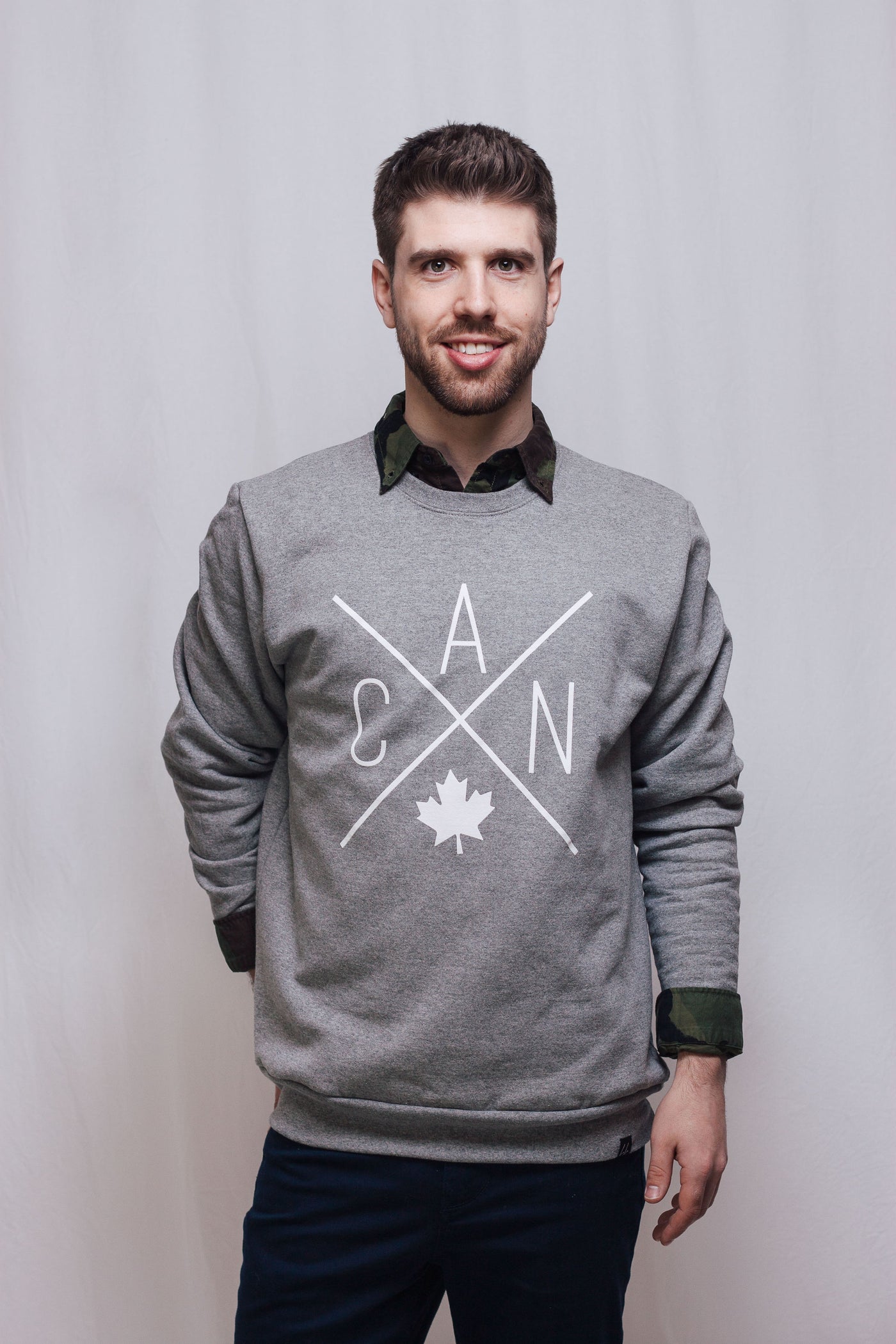 Individual wearing unisex Made in Canada sweater with Local Laundry exclusive CAN Maple Leaf design. 