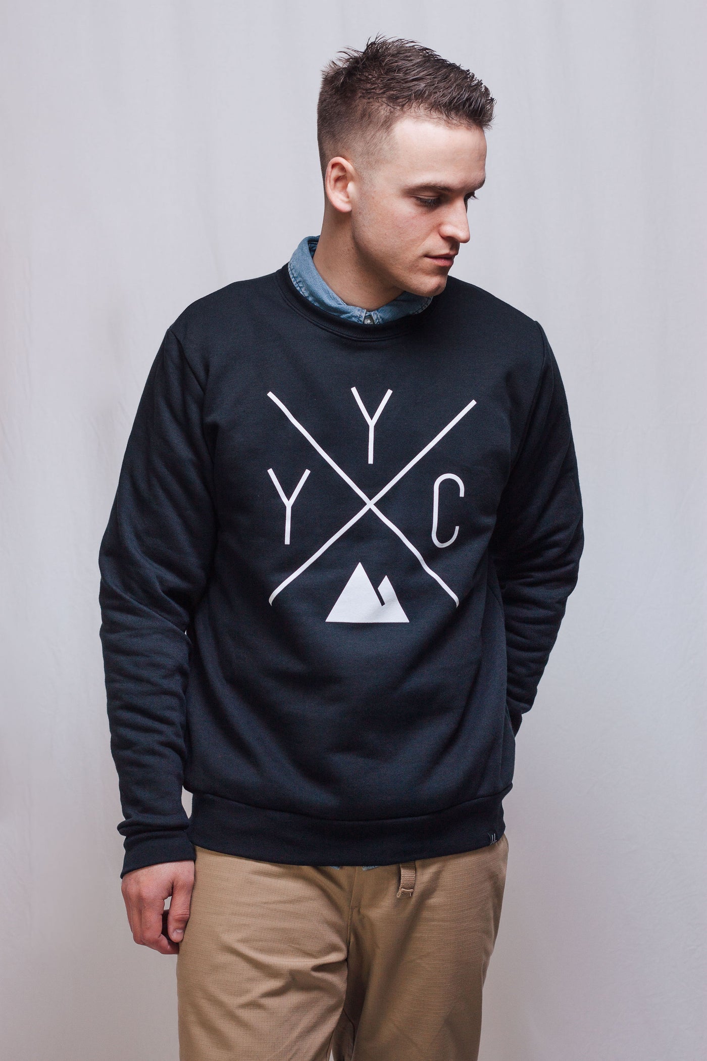 Individual wearing the YYC Crewneck sweater by Local Laundry. Sustainably made in Canada.