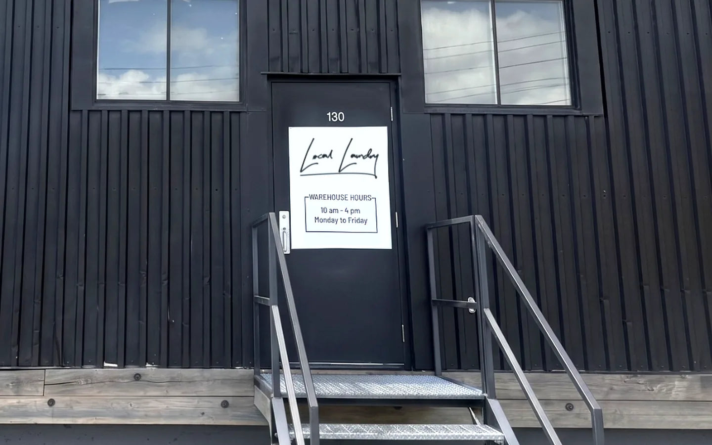 Local Laundry warehouse pickup entrance — Bay 130, 1212 34 Ave SE, Calgary